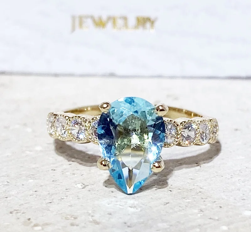 Emerald Gemstone Rings with Filigree - Bordered SettingsAquamarine Ring - March Birthstone - Statement Engagement Ring with Pear-Shaped Aquamarine Gemstone and Clear Quartz Accents