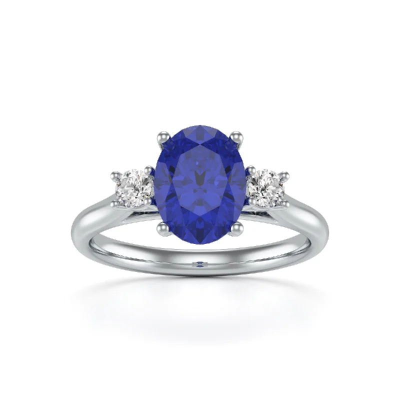 Sapphire Gemstone Rings in a Cathedral SettingBlue Sapphire Oval Trilogy Ring with Diamond Side Stones