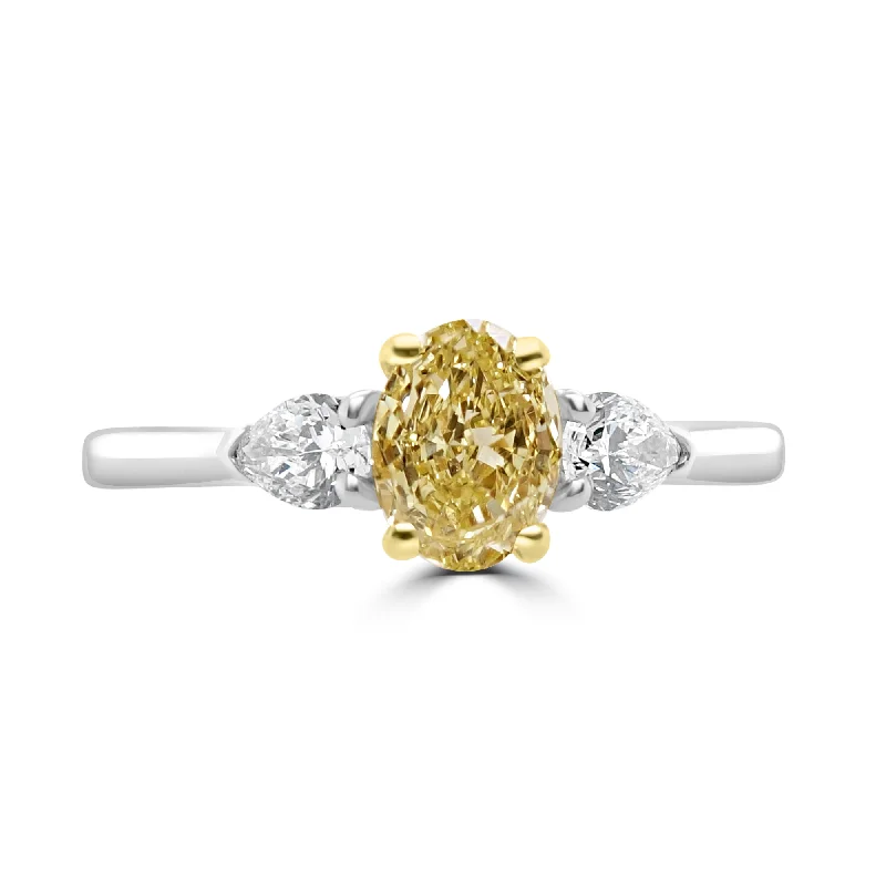 Halo - Style Diamond Rings with Smaller Accent DiamondsPlatinum And 18ct Yellow Gold 1.02ct Oval Cut Yellow Diamond And 0.25ct Pear Cut Diamond Three Stone Ring