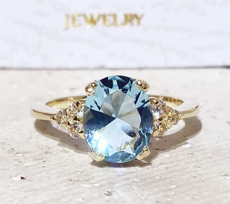 Sapphire Gemstone Rings in a Cathedral SettingAquamarine Ring - March Birthstone - Statement Engagement Ring with Oval Aquamarine Gemstone and Clear Quartz Accents