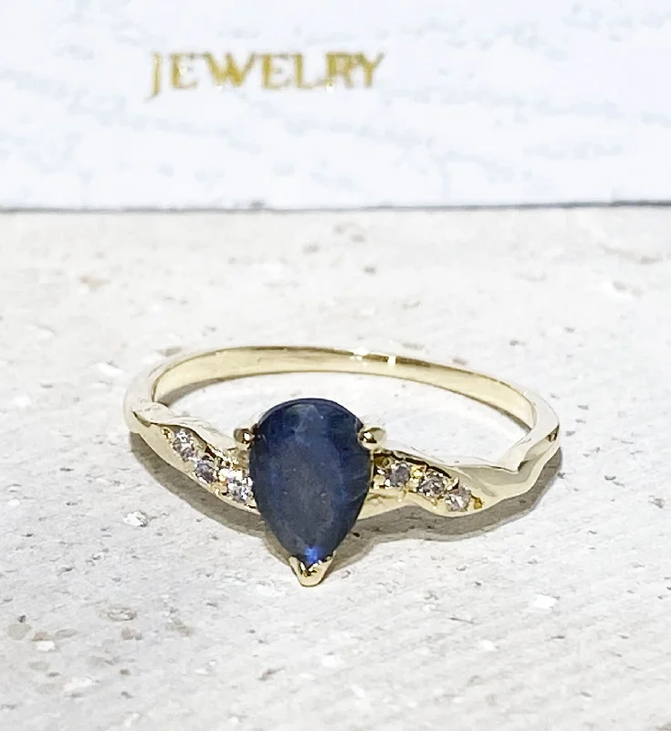 Sapphire Gemstone Rings in a Cathedral SettingLabradorite Ring - Delicate Ring with Pear-Shaped Labradorite Gemstone and Clear Quartz Accents