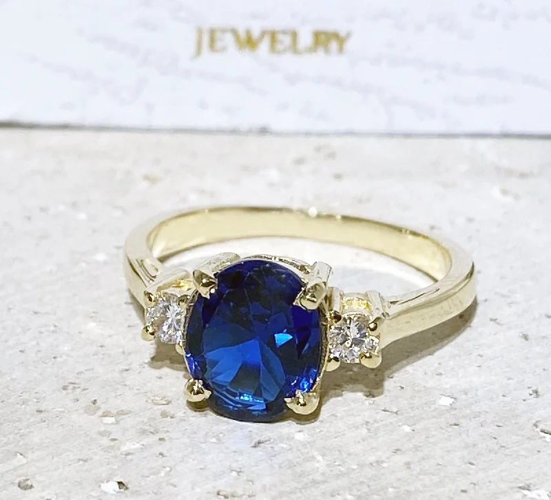 Multi - Gemstone Rings with a Rainbow of ColorsBlue Sapphire Ring - September Birthstone - Statement Engagement Ring with Oval Blue Sapphire Gemstone and Clear Quartz Accents