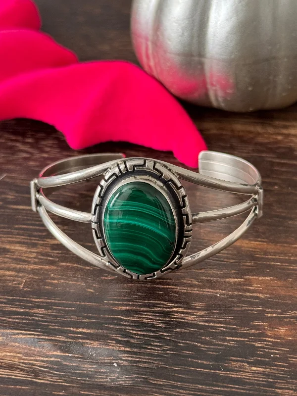 Cuff Bracelets with Hidden Clasps for a Seamless LookNavajo Made Malachite & Sterling Silver Cuff Bracelet