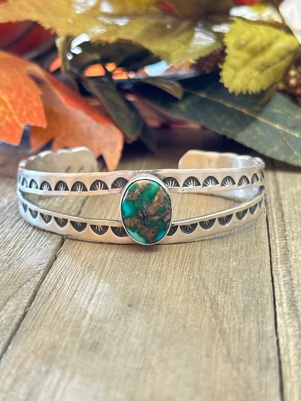 Leather Cuff Bracelets with Metal Stud EmbellishmentsNavajo Made Sonoran Mountain Turquoise & Sterling Silver Cuff Bracelet.