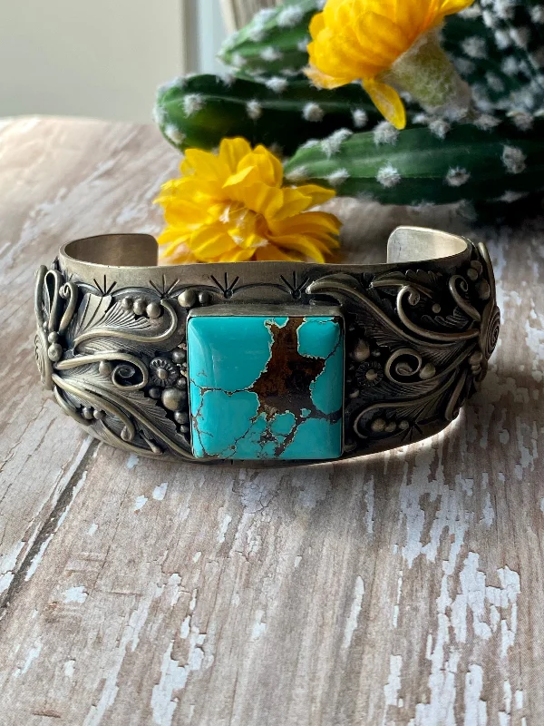 Cuff Bracelets with a Hinged Design for Added FlexibilityJimmy Lee #8 Turquoise Turquoise & Sterling Silver Cuff Bracelet