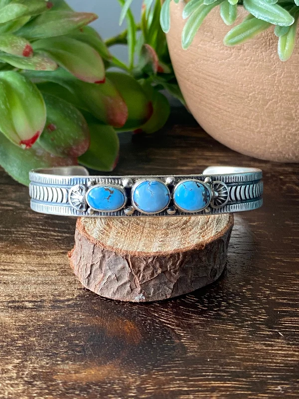 Leather Cuff Bracelets with Metal Stud EmbellishmentsFrancis Yazzie Golden Hill’s Turquoise & Sterling Silver Cuff Bracelet