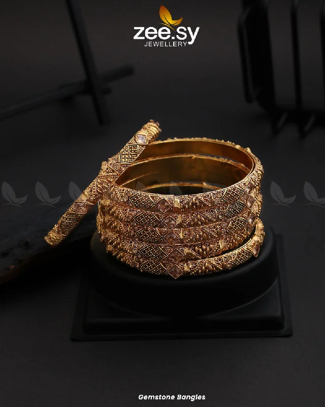 Solid Gold Bangles with Intricate EngravingsGemstone Bangles