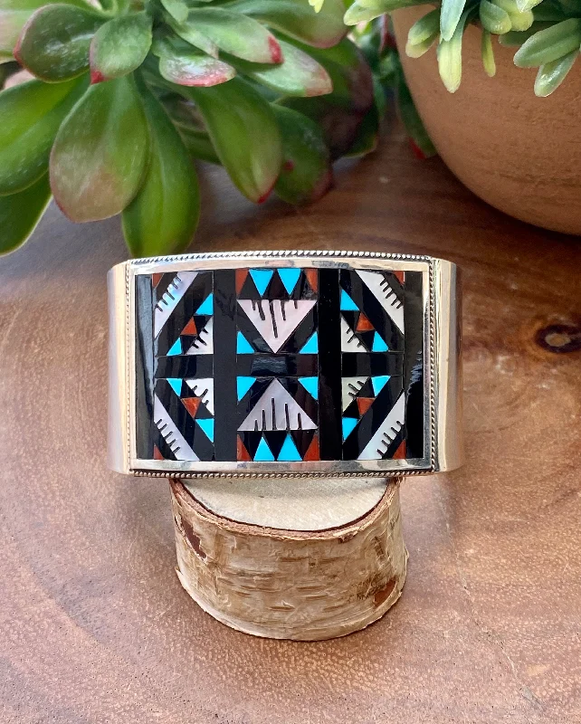 Sterling Silver Cuff Bracelets in Geometric DesignsLeander & Lisa Othole Zuni Multi Stone & Sterling Silver Inlay Cuff Bracelet