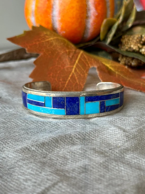 Cuff Bracelets with Hidden Clasps for a Seamless LookNavajo Made Multi Stone & Sterling Silver Inlay Cuff Bracelet