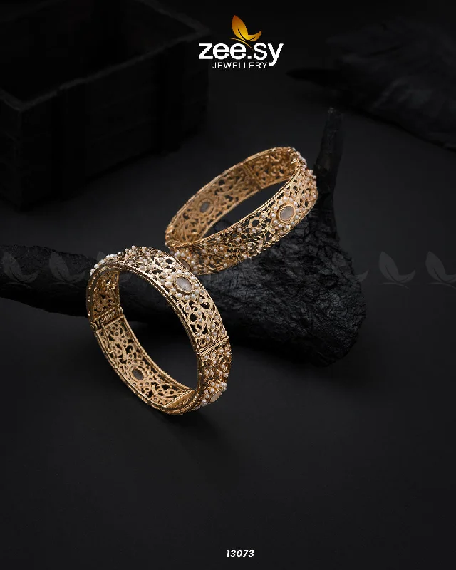 Solid Gold Bangles with Intricate EngravingsHyderabadi kara Bangles