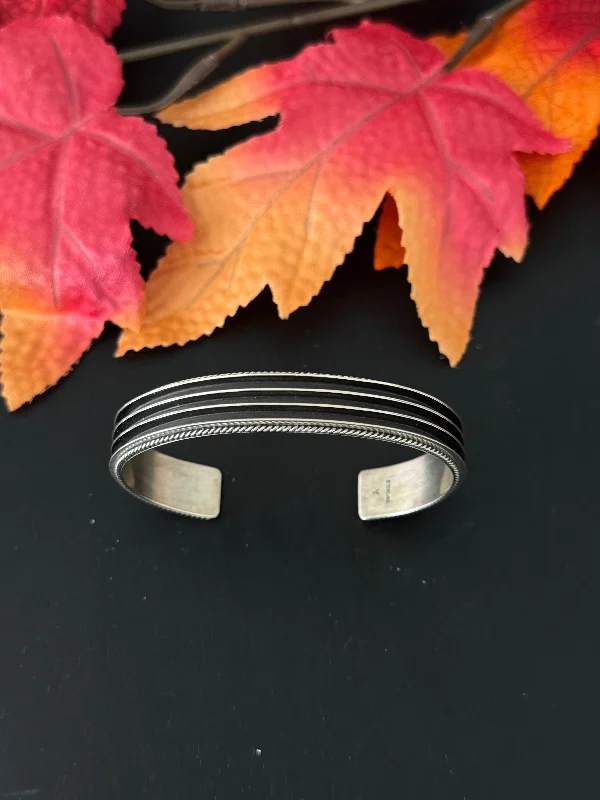 Cuff Bracelets with Hidden Clasps for a Seamless LookArnold Yazzie Sterling Silver Cuff Bracelet