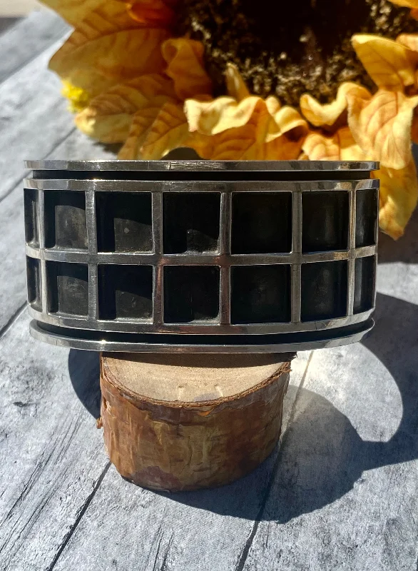 Leather Cuff Bracelets with Metal Stud EmbellishmentsVintage Navajo Made Sterling Silver Cuff Bracelet